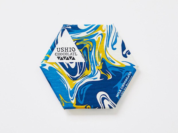 夏目坂珈琲のブルーとミルクのベージュが溶け合うようなパッケージデザイン
