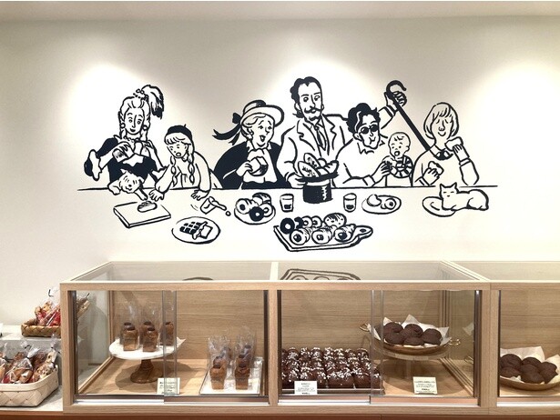 セルフ販売のショーケース。みんながパンを食べて笑顔になるイラストにほっこり！